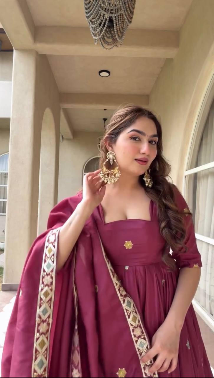 Majestic Wine Flared Anarkali Suit Set Adorned with Delicate Floral Scattered Motifs and an Ornate Heritage Embroidered Border